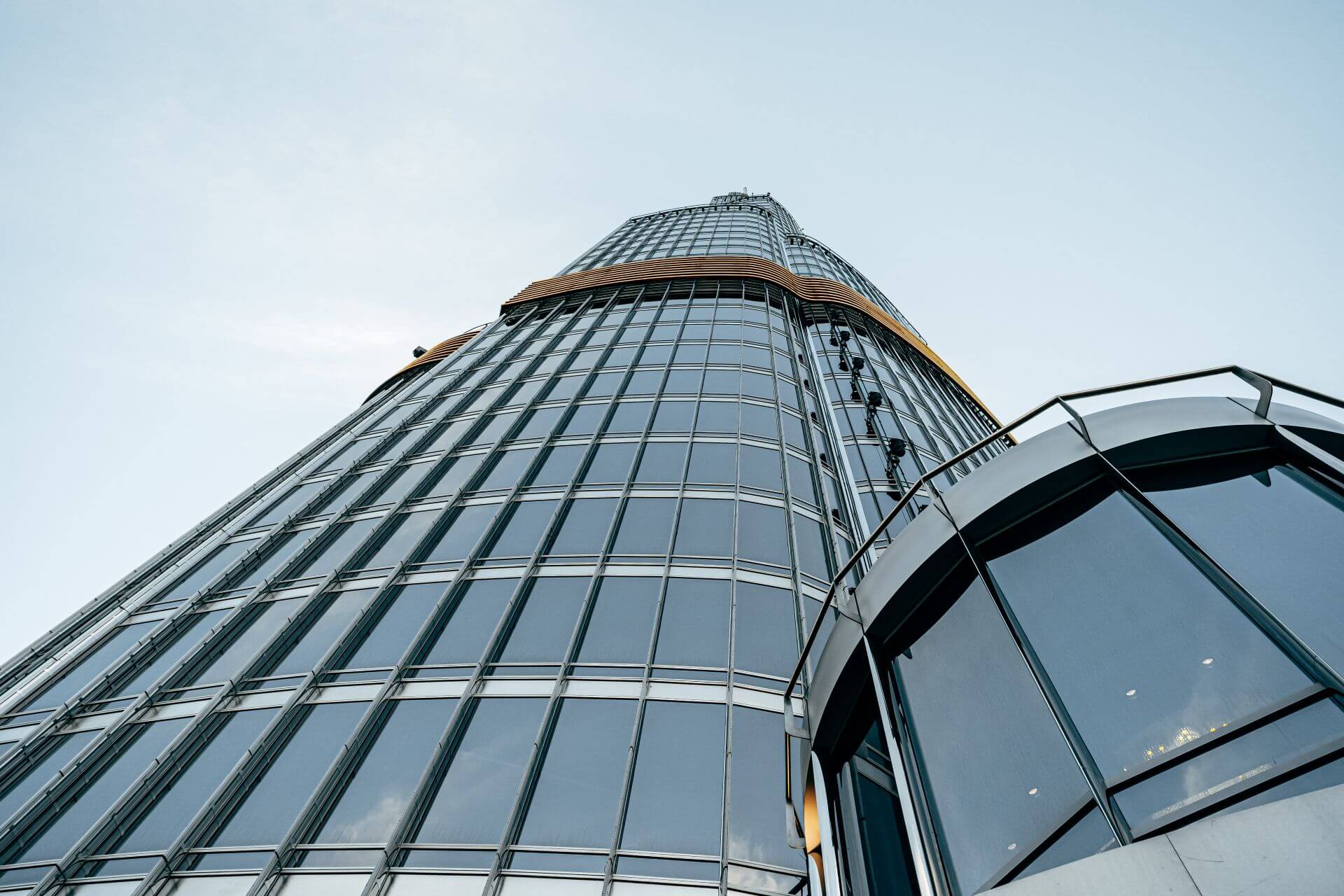 tall-glass-building-against-blue-sky-view-from-th-2023-11-27-05-02-25-utc.jpg